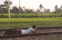 train passes over a boy lying on the rails