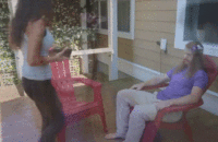 boy kicking a chair his girl