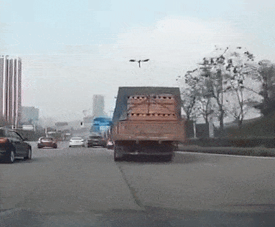 truck turns and crushes a car