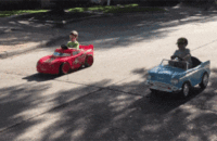 children on drag racing with baby carts